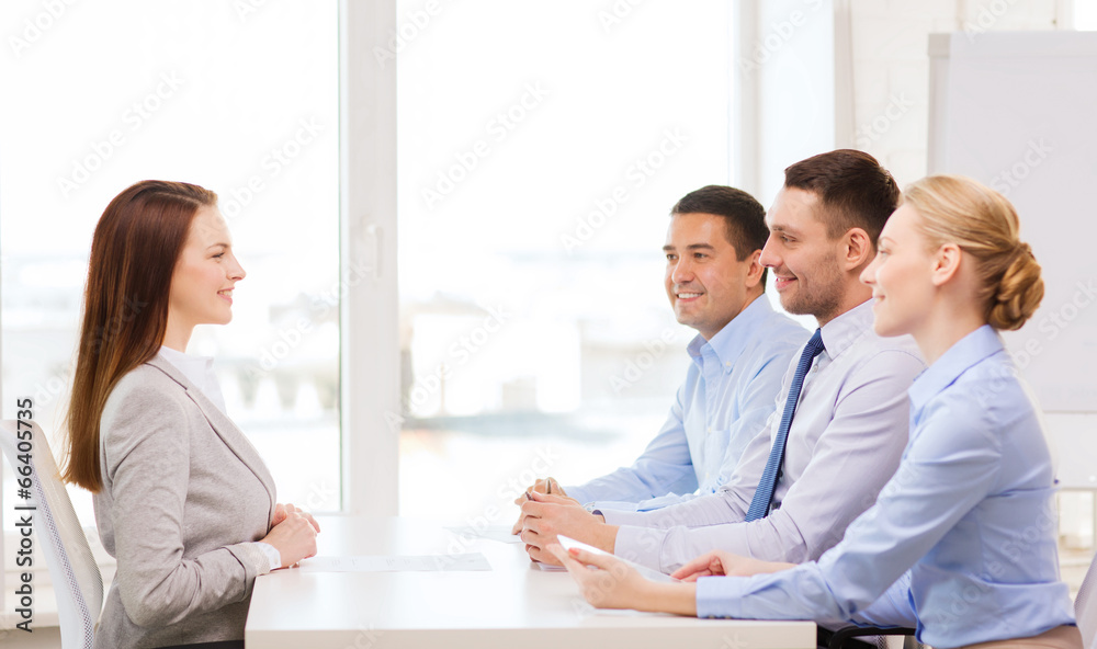 smiling businesswoman at interview in office smiling businesswoman at interview in office