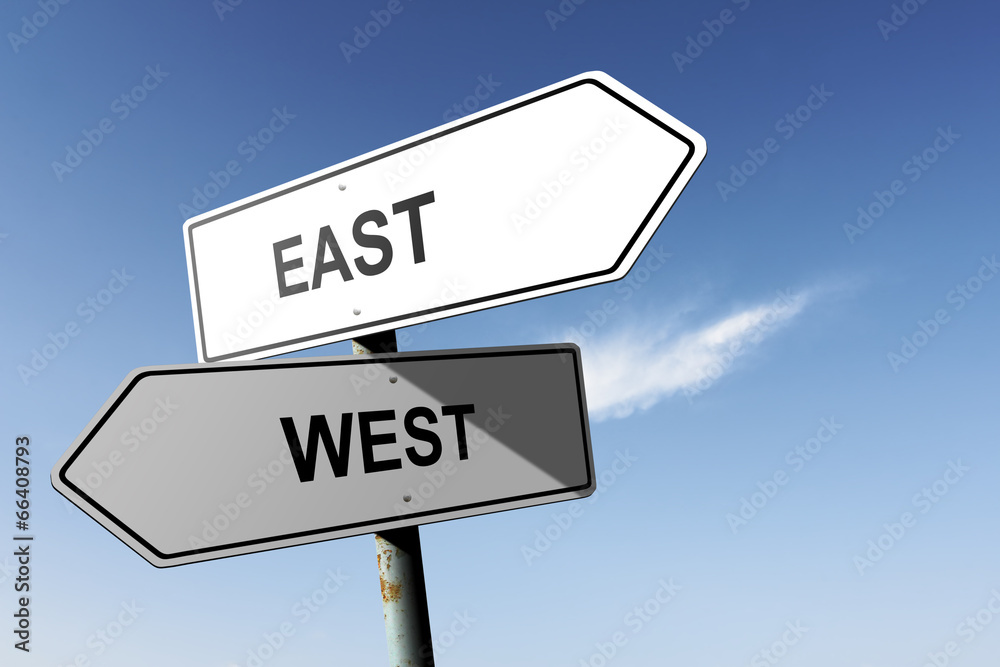 East and West directions. Opposite traffic sign. East and West directions. Opposite traffic sign.