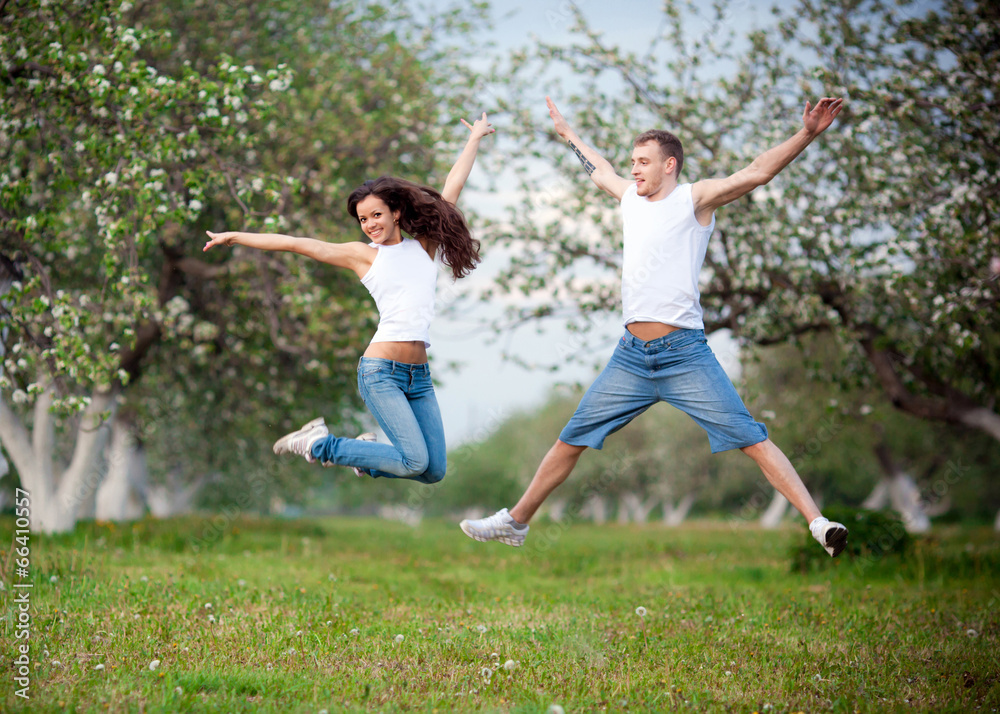A shot of a happy couple jumping for joy A shot of a happy couple jumping for joy
