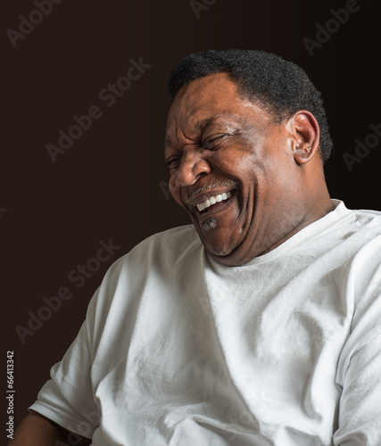middle aged African American man laughing