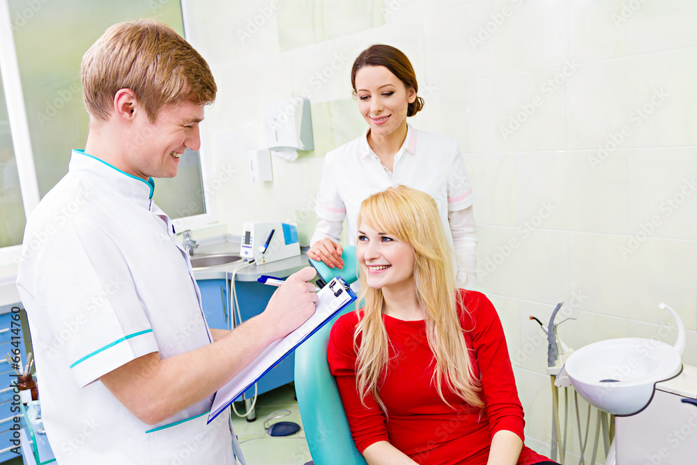 Female patient in dentist office, answering doctor questions Female patient in dentist office, answering doctor questions