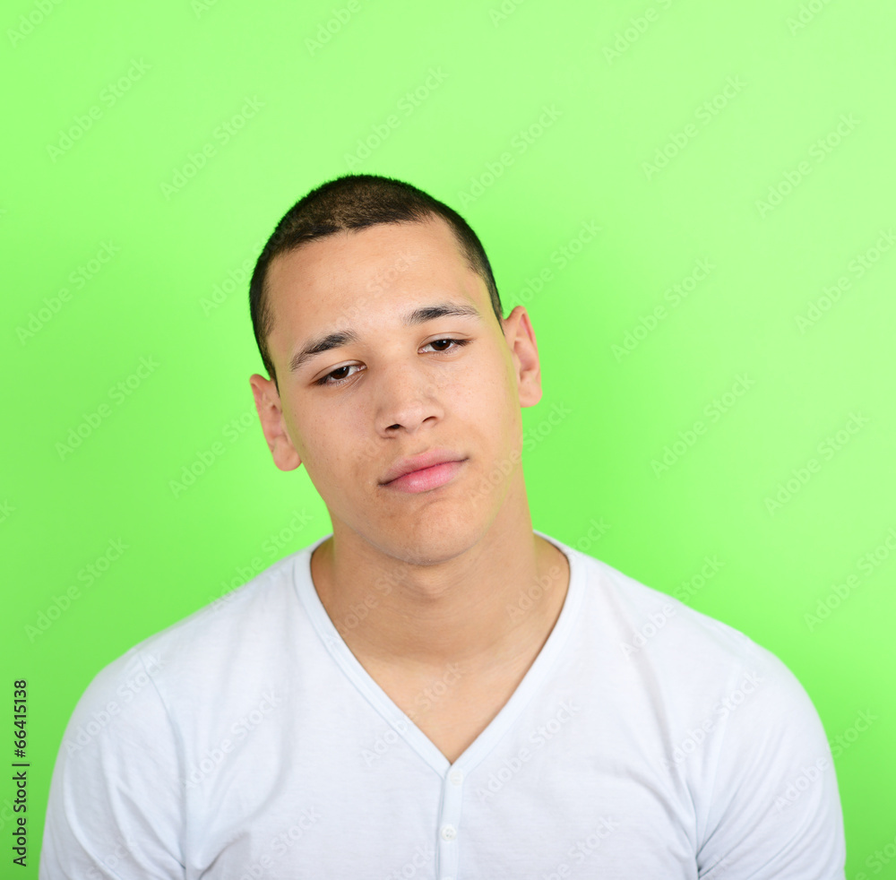 Portrait of tired man against green background Portrait of tired man against green background