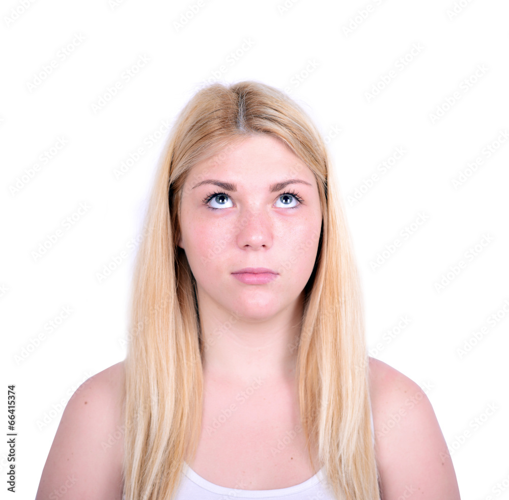Portrait of beautiful girl looking up against white background Portrait of beautiful girl looking up against white background