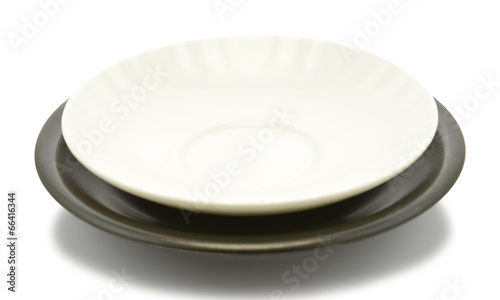 black and white empty plate over a white background
