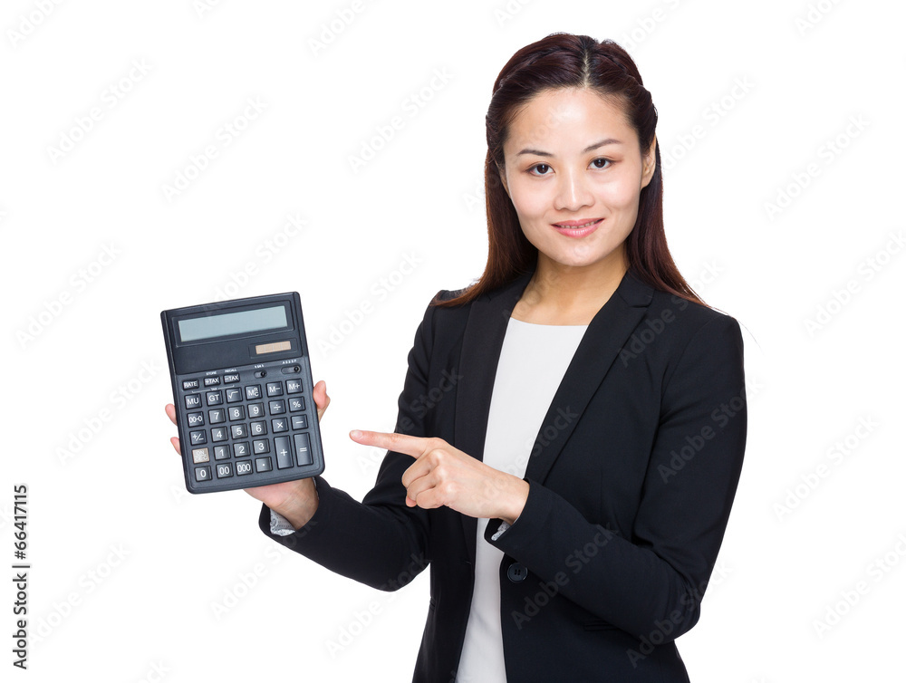 Woman accountant with finger point to calculator Woman accountant with finger point to calculator