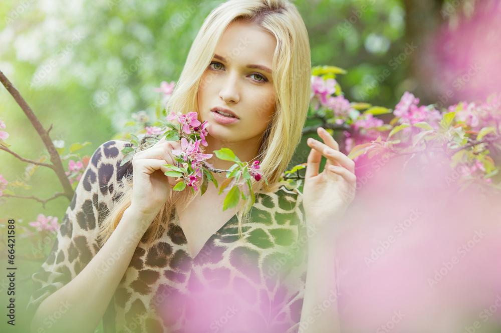 Young attractive woman in blooming spring trees Young attractive woman in blooming spring trees