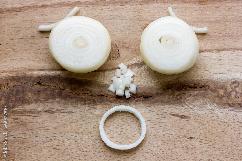 onion bulb on wooden cutting board