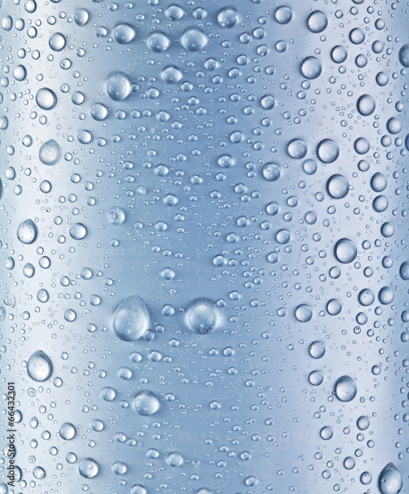 Water drops over blue glass background.