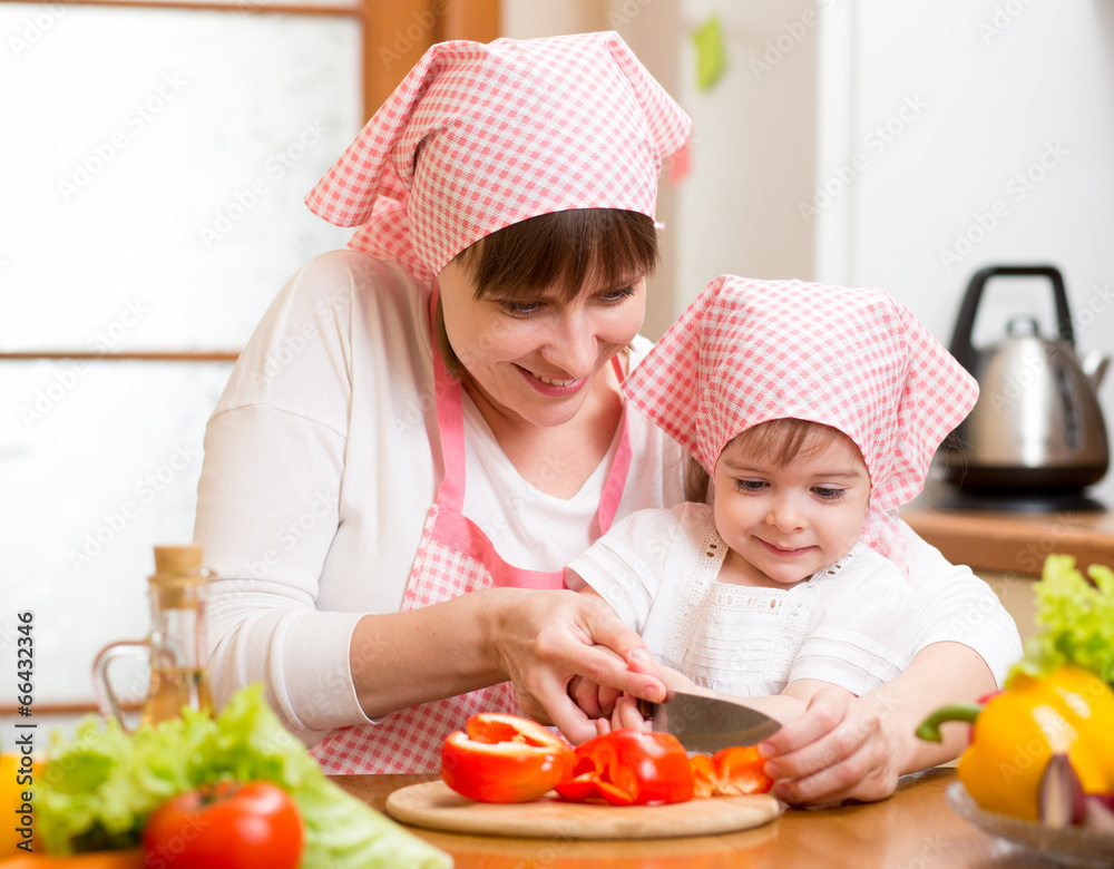 mom and kid girl preparing healthy food mom and kid girl preparing healthy food