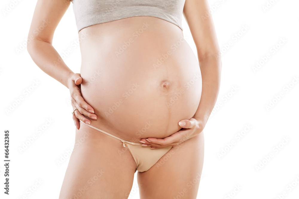 stomach of pregnant woman on white background