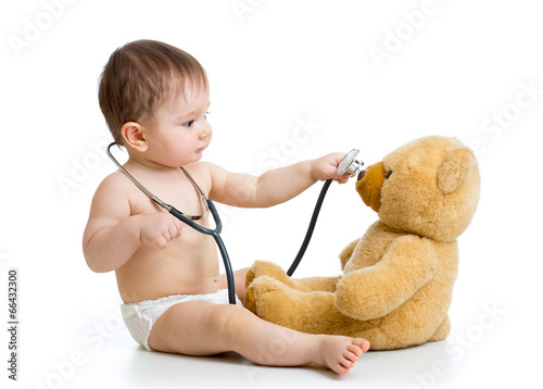 kid boy playing doctor with...