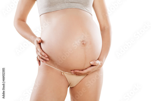 stomach of pregnant woman on white background