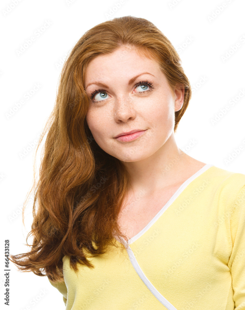 Young happy woman is looking up and smile Young happy woman is looking up and smile