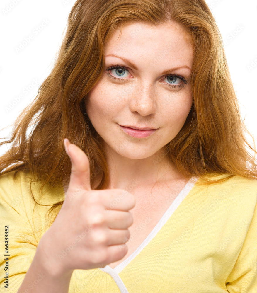 Woman is showing thumb up gesture Woman is showing thumb up gesture