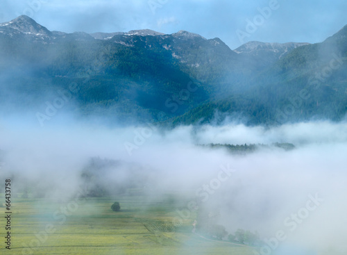 Alpine valley in the fog, Slovenia