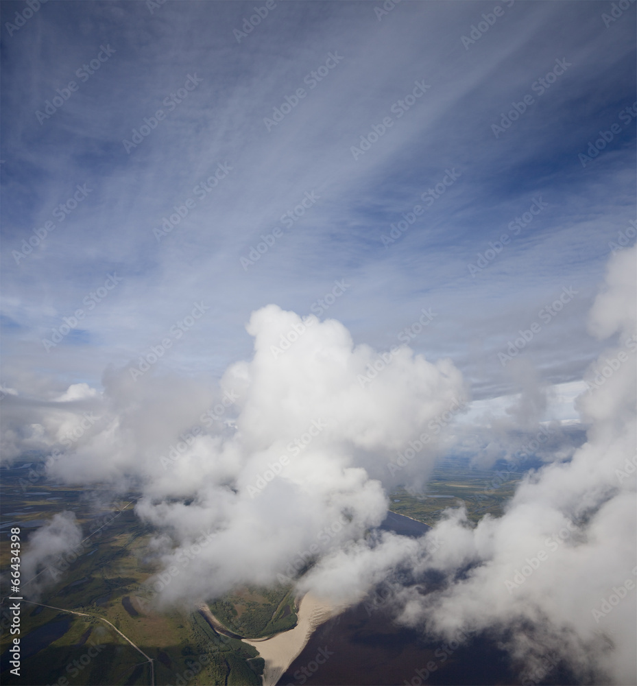 Top view of clouds above lowland of the great river Top view of clouds above lowland of the great river