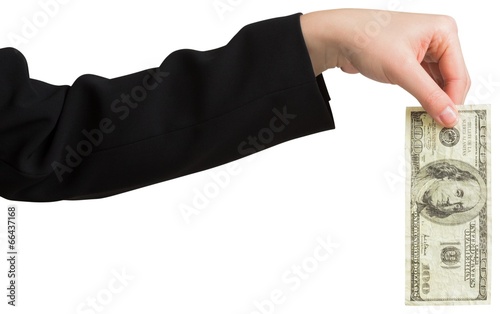 Businesswomans hand holding hundred dollar bill