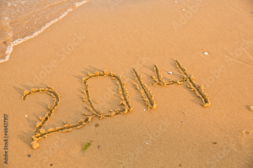 2014 numbers on the yellow sandy beach © len44ik