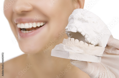 Woman holding a teeth sample photo