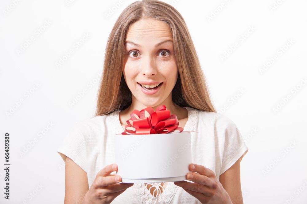 young woman holding white round gift box young woman holding white round gift box