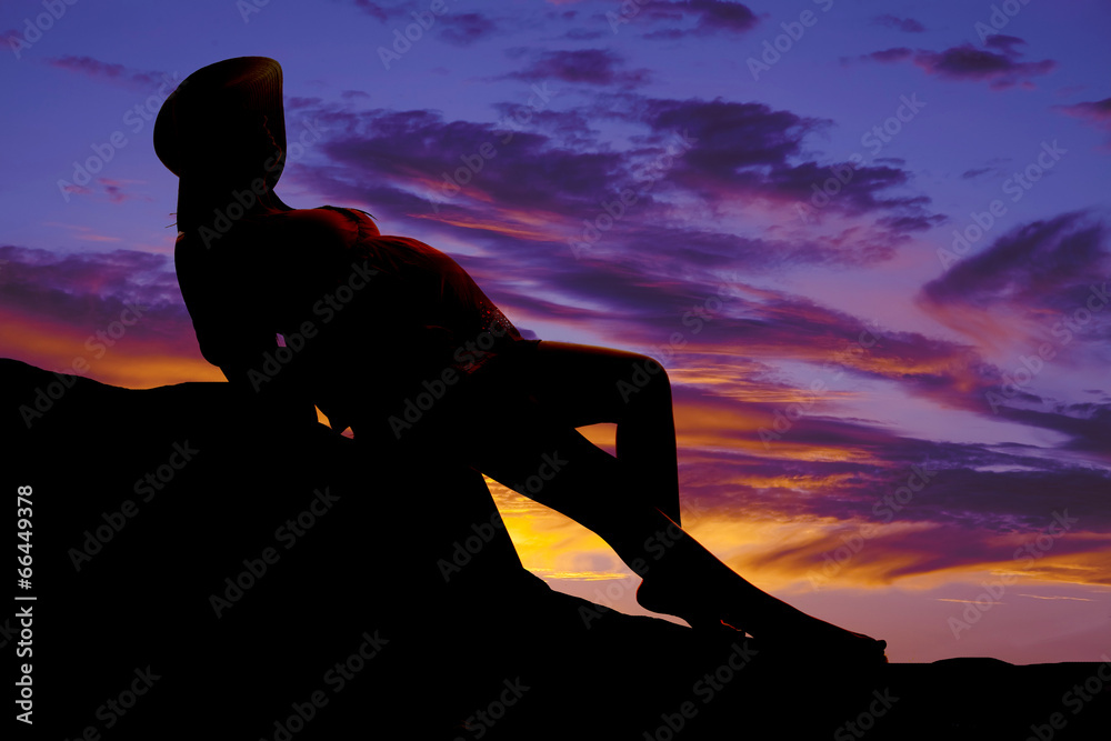 silhouette pregnant woman hat on sitting in chair