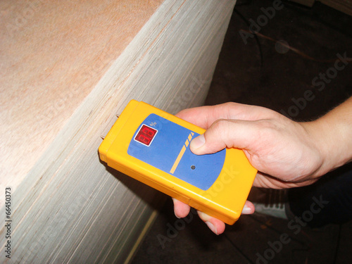 Worker Measuring Level of Moisture Density for Quality Assurance