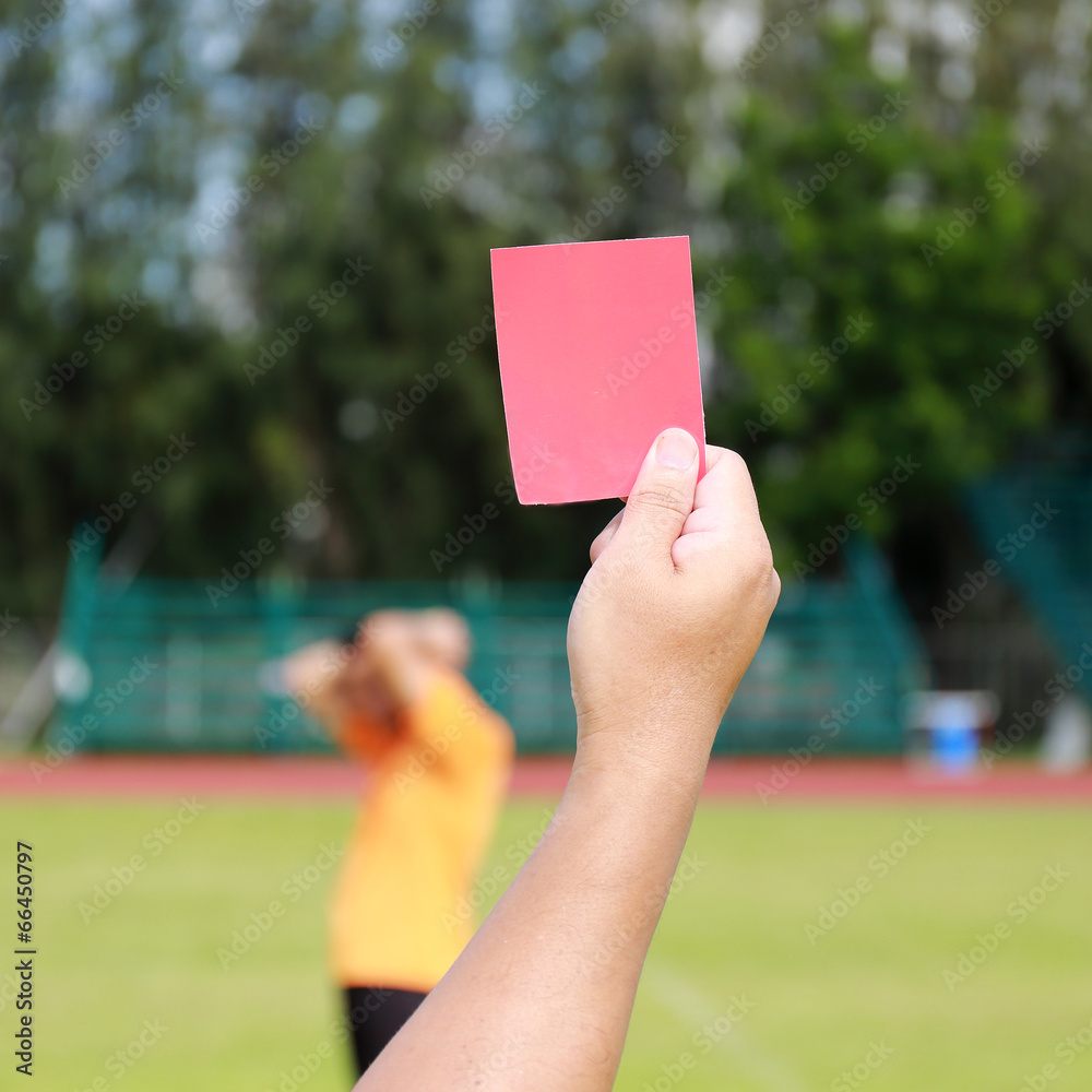 Hand of referee with red card Hand of referee with red card