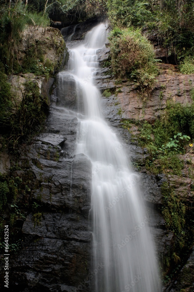 Deep forest waterfall at National Park Si-satchanalai Thailand