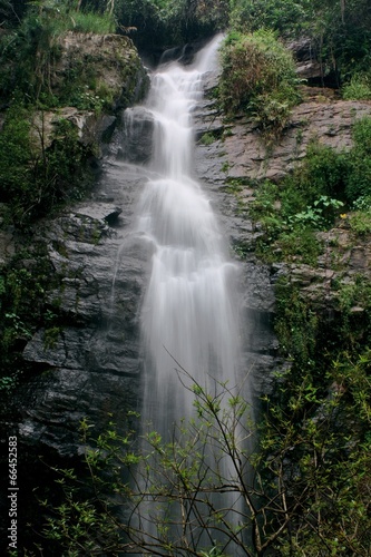 Deep forest waterfall at National Park Si-satchanalai Thailand