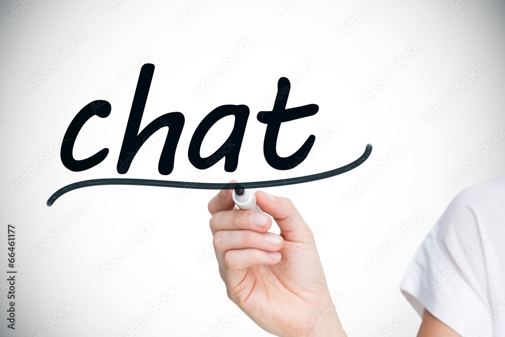 Businesswoman writing the word chat Businesswoman writing the word chat