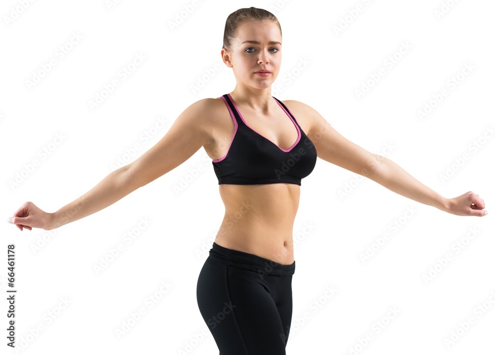 Fit brunette stretching and looking at camera Fit brunette stretching and looking at camera