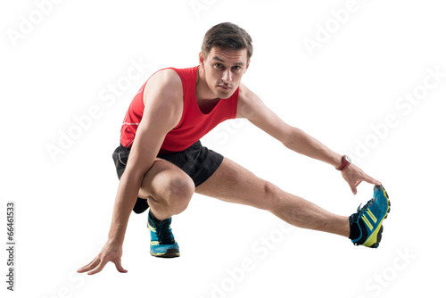 Man doing stretching exercises on the floor © undrey