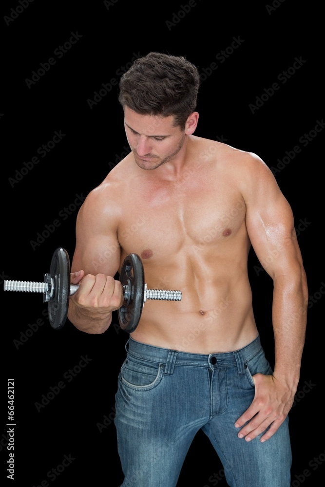 Muscular man lifting dumbbell in blue jeans Muscular man lifting dumbbell in blue jeans