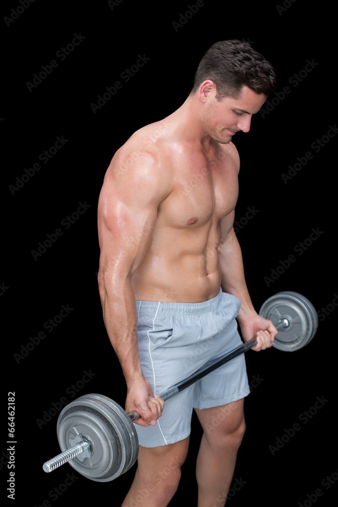 Focused crossfitter lifting up heavy barbell Focused crossfitter lifting up heavy barbell