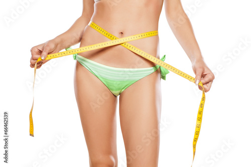 pretty girl measured her waist