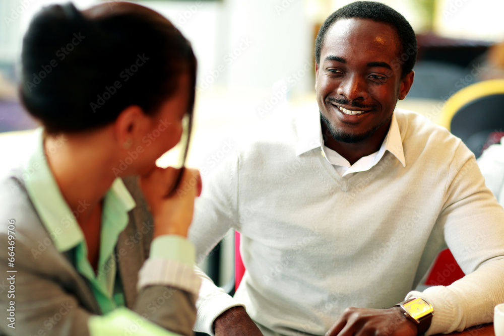 Happy young businesspeople working at office Happy young businesspeople working at office