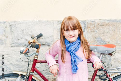 Outdoor portrait of a cute little girl photo