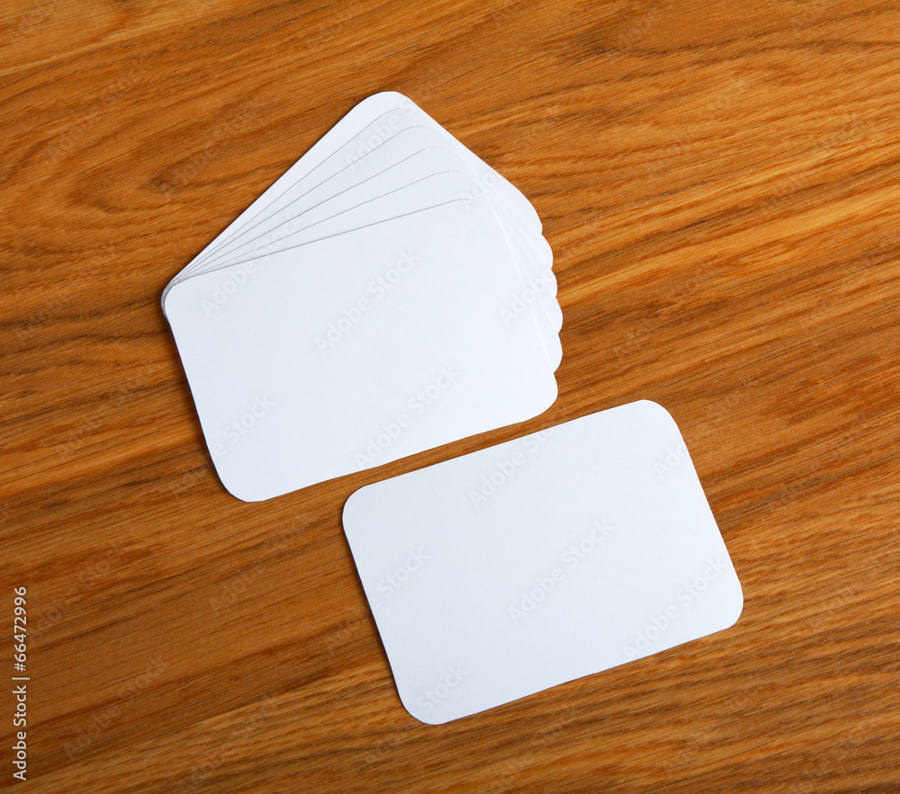 blank business cards with rounded corners on a wooden background blank business cards with rounded corners on a wooden background