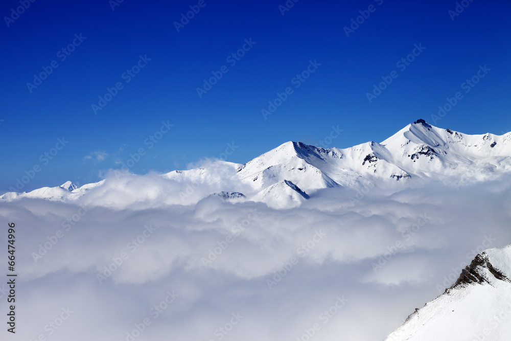 Mountains in clouds at nice day