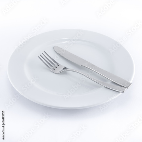 White plate, knife and fork