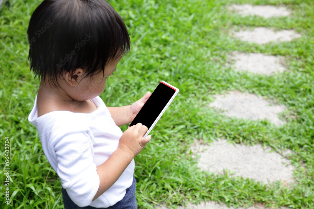 child using a digital tablet or smart phone