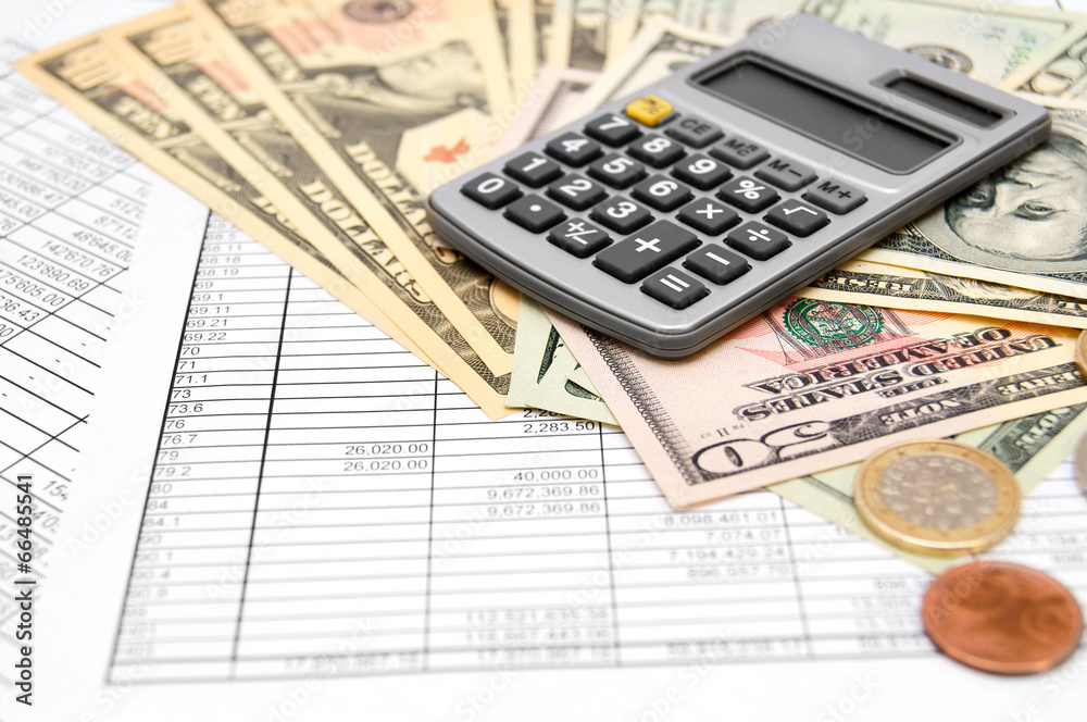 Calculator and money on the documents Calculator and money on the documents