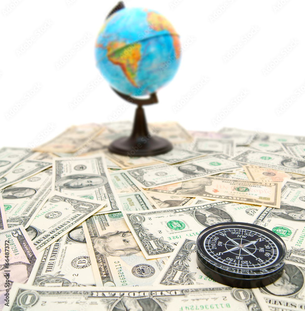Compass and globe on dollars. On a white background. Compass and globe on dollars. On a white background.