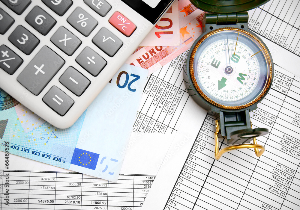 Compass, the calculator and euro on documents. Compass, the calculator and euro on documents.