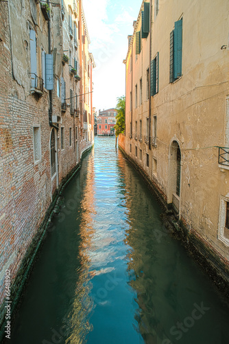Ancient buildings in the channel in Venice.