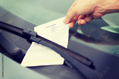 parking ticket on car windscreen photo