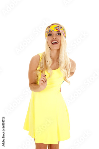 woman yellow dress headband stand laugh