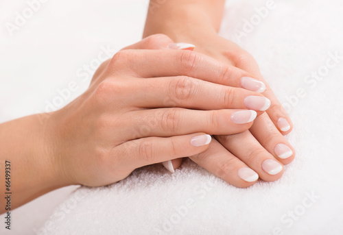 Hands on a towel with manicure