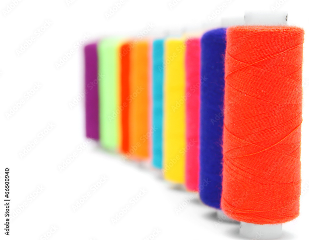 Multi-coloured threads. On a white background. Multi-coloured threads. On a white background.