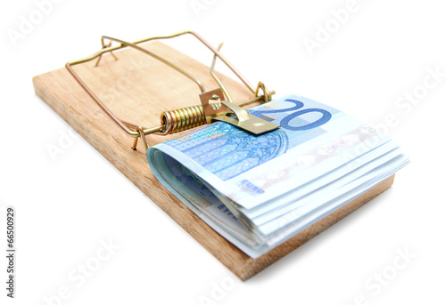 Money in a mousetrap. On a white background.